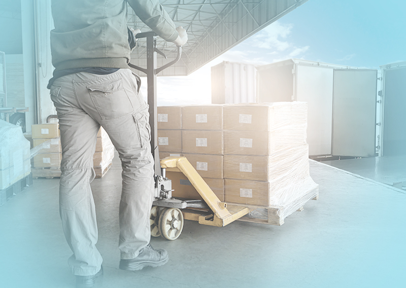 Worker moving pallets.